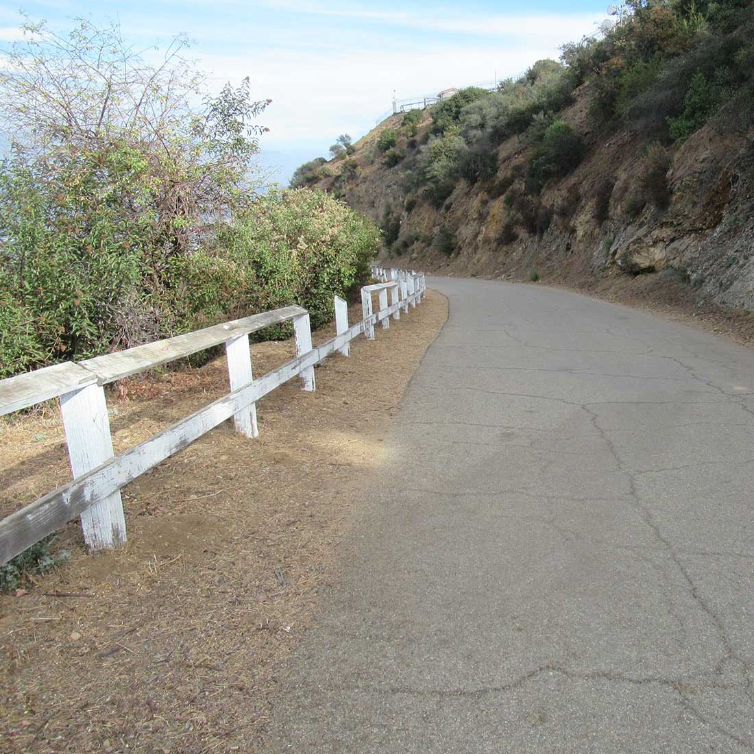 13M-White-Slatted-Fence-Downhill